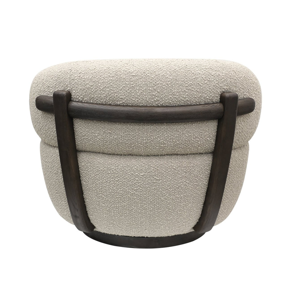 Back view of boucle upholstered swivel chair with smooth curved lines and dark wood base detail