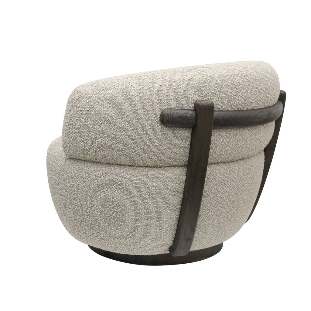 Contemporary boucle armchair with wraparound backrest and swivel base, shown at a three-quarter angle