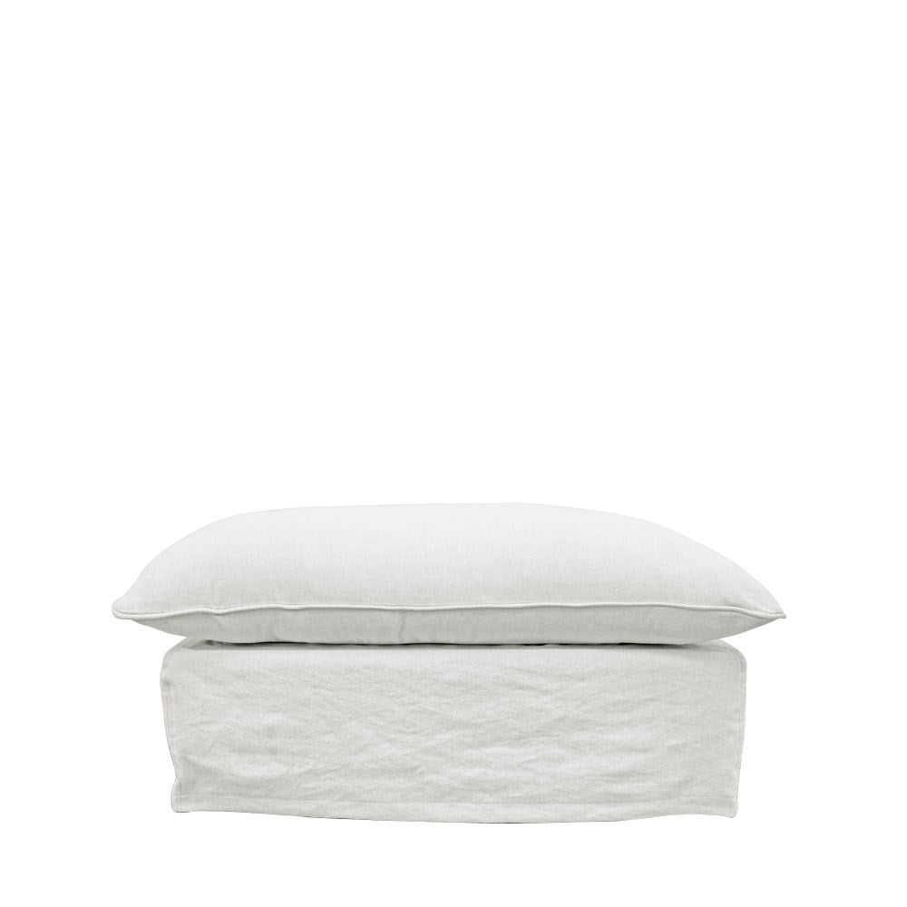 Minimalist white linen ottoman with a cushioned top and structured base, shown on a plain background.