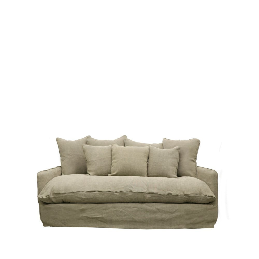 Neutral olive-toned linen sofa with oversized cushions and a relaxed, timeless silhouette.