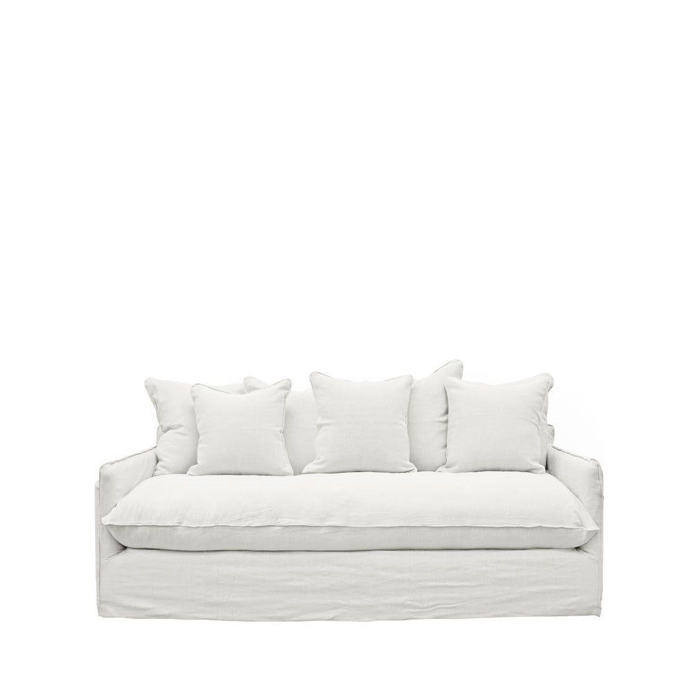 Crisp white linen sofa with a minimalist design, featuring generously padded seat and back cushions.