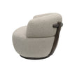 Side view of curved ivory boucle armchair with sculpted silhouette and contemporary design