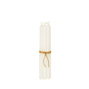 Set of four ivory taper candles tied with a natural leather cord, perfect for elegant dinner settings or home décor.
