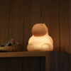 Hippo nightlight on shelf, lit up and glowing for kids that are scared of the dark. 