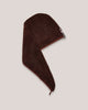 Brown head towel with a brand logo on a light gray background