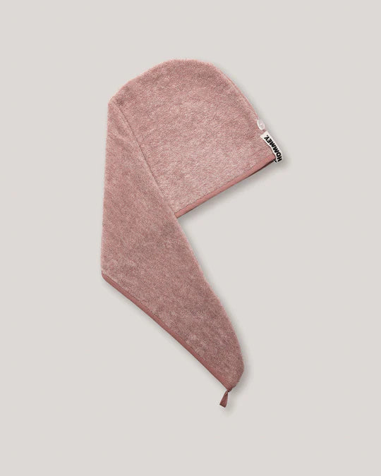 Pink hair towel on a light gray background