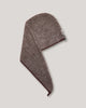 Brown hair towel with a brand logo on a light gray background