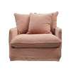 Cosy armchair in clay linen featuring generous cushions and a relaxed, contemporary silhouette.