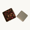 Open tin of ON SUNDAYS mulled wine loose leaf tea, featuring vibrant dried botanicals like elderberry, cinnamon, hibiscus, and ginger.