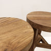 Porto Round Outdoor Stool made from solid teak wood, shown against a white background — minimalist and weather-resistant seating or side table