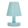 A small table lamp in a glossy light aqua or pastel blue color, featuring a tapered shade, a central stem, and a round base, shown against a plain white background.