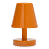 A glossy orange table lamp with a tapered shade, cylindrical stem, and round base, shown on a plain white background.
