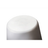 A close-up of a white plastic cap or bottle stopper with a domed top and tapered base, featuring embossed brand text that appears to read 'K&H'.