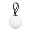 White spherical lamp with a brown handle on a white background