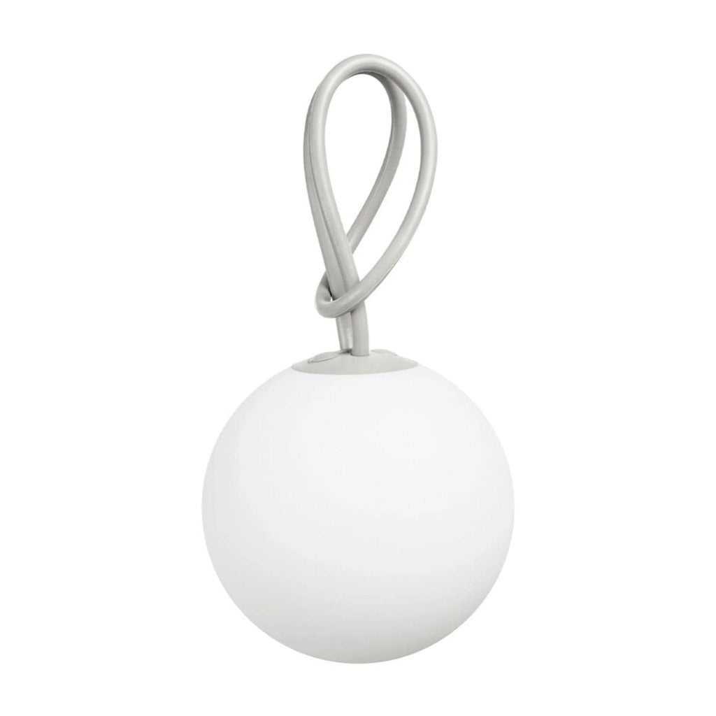 A minimalist modern pendant light featuring a matte white spherical shade and a light gray braided loop handle, shown against a solid white background.