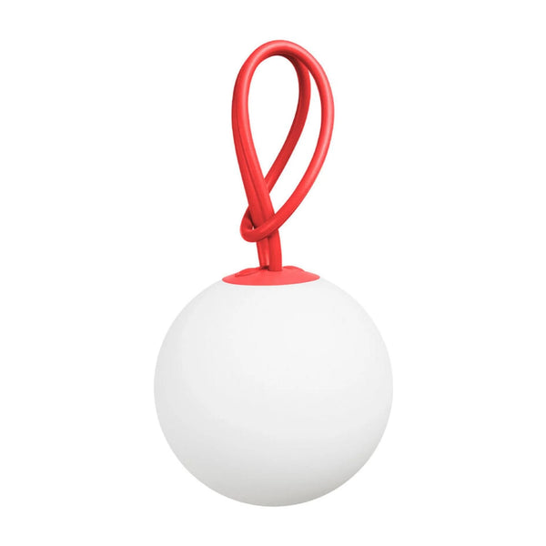 White ball light with a red handle on a white background