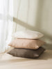 stack of Cittā feather filled cushions