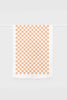 White tea towel featuring an orange checkerboard pattern, hanging neatly on a white rail with 'Lettermade' branding at the bottom.