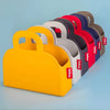 A set of six Fabboby handbag-shaped bag in assorted colours, arranged in a diagonal row on a light blue background.