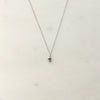 Silver necklace with a heart pendant and small diamond on delicate chain